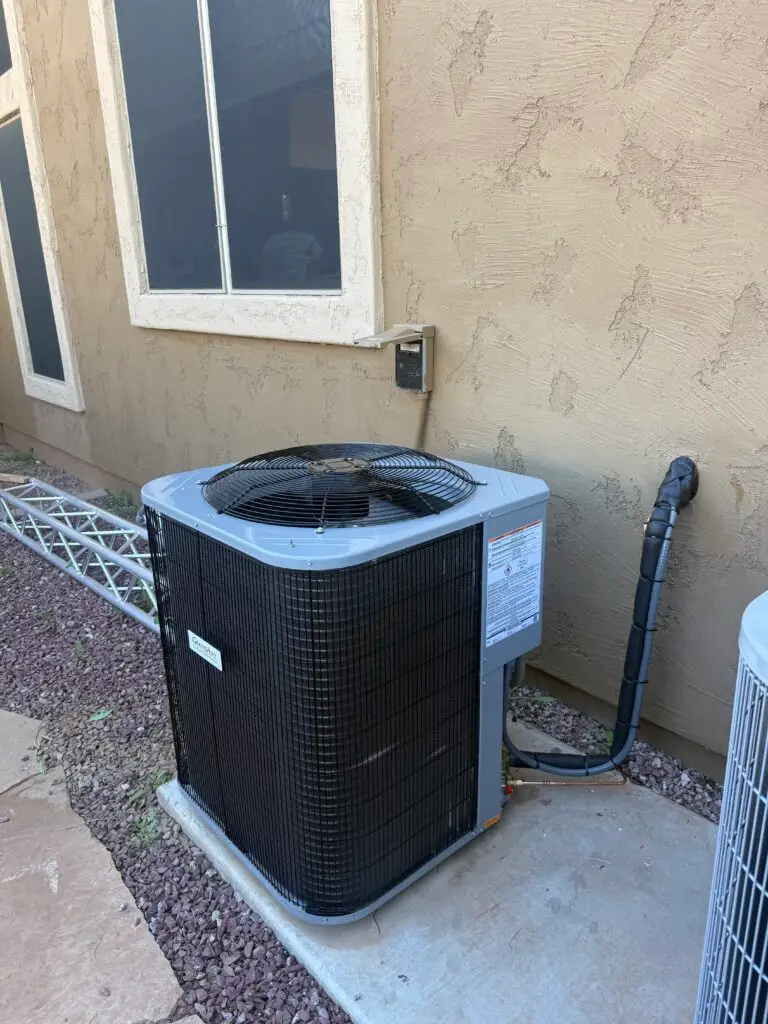 Paganelli HVAC technician servicing an AC unit in Arizona